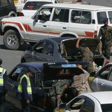 Police troopers inspect cars at a checkpoint near the Defence Ministry compound in Sanaa December 7, 2013. REUTERS/Khaled Abdullah Police troopers inspect cars at a checkpoint near the Defence Ministry compound in Sanaa December 7, 2013. REUTERS/Khaled Abdullah