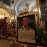 A poster depicting former South African President Nelson Mandela is displayed during a special service in his honour at the Holy Family Chur A poster depicting former South African President Nelson Mandela is displayed during a special service in his honour at the Holy Family Chur