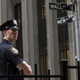 A New York City police officer stands outside the New York Stock Exchange, on Wall Street, May 14, 2012. REUTERS/Brendan McDermid A New York City police officer stands outside the New York Stock Exchange, on Wall Street, May 14, 2012. REUTERS/Brendan McDermid