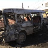 A man looks at a damaged vehicle after a car bomb attack at Bayaa district in Baghdad December 8, 2013. REUTERS/Ahmed Malik A man looks at a damaged vehicle after a car bomb attack at Bayaa district in Baghdad December 8, 2013. REUTERS/Ahmed Malik