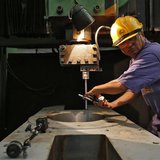 An employee works on the production line inside the heavy electrical manufacturing unit of Larsen & Turbo in Mumbai December 4, 2013. REUTER An employee works on the production line inside the heavy electrical manufacturing unit of Larsen & Turbo in Mumbai December 4, 2013. REUTER