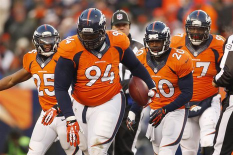 Dec 8, 2013; Denver, CO, USA; Denver Broncos defensive tackle Terrance Knighton (94) after catching an interception during the second half a Dec 8, 2013; Denver, CO, USA; Denver Broncos defensive tackle Terrance Knighton (94) after catching an interception during the second half a