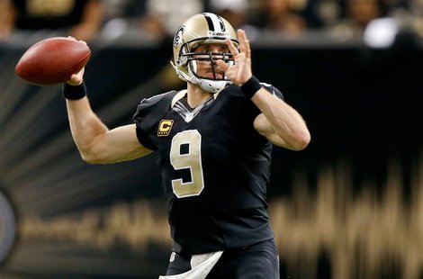 Dec 8, 2013; New Orleans, LA, USA; New Orleans Saints quarterback Drew Brees (9) throws a pass against the Carolina Panthers during the seco Dec 8, 2013; New Orleans, LA, USA; New Orleans Saints quarterback Drew Brees (9) throws a pass against the Carolina Panthers during the seco