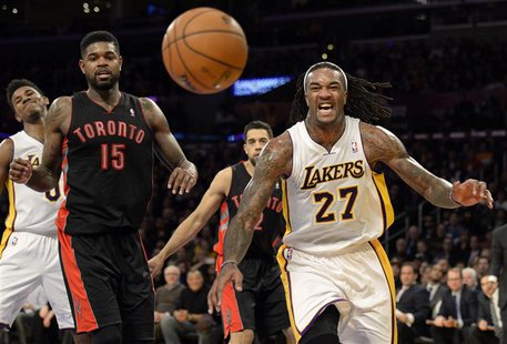 Dec 8, 2013; Los Angeles, CA, USA; Los Angeles Lakers center Jordan Hill (27) and Toronto Raptors power forward Amir Johnson (15) watch as t Dec 8, 2013; Los Angeles, CA, USA; Los Angeles Lakers center Jordan Hill (27) and Toronto Raptors power forward Amir Johnson (15) watch as t