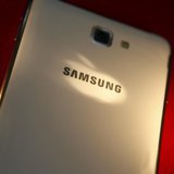 The logo of Apple Inc is reflected on the back of a Samsung Galaxy Note smartphone in this photo illustration taken in Beijing June 5, 2013. The logo of Apple Inc is reflected on the back of a Samsung Galaxy Note smartphone in this photo illustration taken in Beijing June 5, 2013.