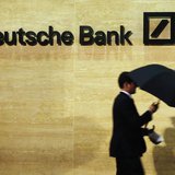 A man walks past Deutsche Bank offices in London December 5, 2013. REUTERS/Luke MacGregor A man walks past Deutsche Bank offices in London December 5, 2013. REUTERS/Luke MacGregor