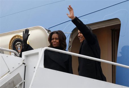 U.S. President Barack Obama and first lady Michelle Obama depart Joint Base Andrews in Washington en route to Johannesburg December 9, 2013. U.S. President Barack Obama and first lady Michelle Obama depart Joint Base Andrews in Washington en route to Johannesburg December 9, 2013.