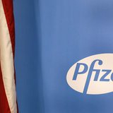 The Pfizer logo is seen next to a U.S. flag in a conference room at their world headquarters in New York November 5, 2013. REUTERS/Adam Hung The Pfizer logo is seen next to a U.S. flag in a conference room at their world headquarters in New York November 5, 2013. REUTERS/Adam Hung