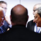 Ireland's Finance Minister Michael Noonan talks to European Central Bank (ECB) President Mario Draghi (R) during an eurozone finance ministe Ireland's Finance Minister Michael Noonan talks to European Central Bank (ECB) President Mario Draghi (R) during an eurozone finance ministe