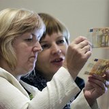 People learn to differentiate between original (bottom) and counterfeit euro banknotes during a workshop in Salacgriva September 24, 2013. R People learn to differentiate between original (bottom) and counterfeit euro banknotes during a workshop in Salacgriva September 24, 2013. R