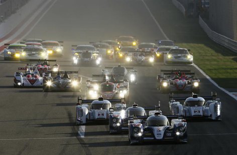 Race cars compete during the start of the final race of the 2013 World Endurance Championship (WEC) Six Hours of Bahrain at the Bahrain Inte Race cars compete during the start of the final race of the 2013 World Endurance Championship (WEC) Six Hours of Bahrain at the Bahrain Inte