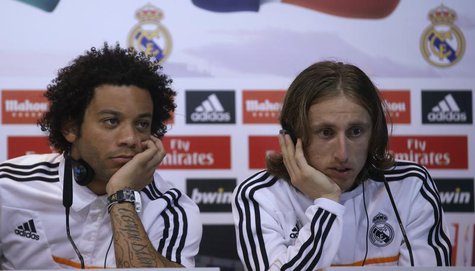 Real Madrid's Marcelo (L) and Luka Modric attend a news conference to discuss the draw for the 2014 World Cup at the Valdebebas training gro Real Madrid's Marcelo (L) and Luka Modric attend a news conference to discuss the draw for the 2014 World Cup at the Valdebebas training gro