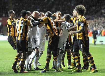 Swansea City and Hull City players scuffle during their English Premier League soccer match at the Liberty Stadium in Swansea, Wales, Decemb Swansea City and Hull City players scuffle during their English Premier League soccer match at the Liberty Stadium in Swansea, Wales, Decemb