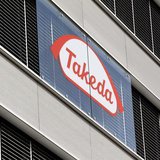 The logo of Japanese Takeda Pharmaceutical Co is seen at an office building in Glattbrugg near Zurich March 7, 2012. REUTERS/Arnd Wiegmann The logo of Japanese Takeda Pharmaceutical Co is seen at an office building in Glattbrugg near Zurich March 7, 2012. REUTERS/Arnd Wiegmann
