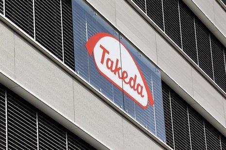 The logo of Japanese Takeda Pharmaceutical Co is seen at an office building in Glattbrugg near Zurich March 7, 2012. REUTERS/Arnd Wiegmann The logo of Japanese Takeda Pharmaceutical Co is seen at an office building in Glattbrugg near Zurich March 7, 2012. REUTERS/Arnd Wiegmann