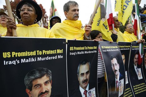 Supporters of Iranian opposition group Mujahadin-e-Khalq (MEK) rally against Iraq's Prime Minister Nuri al-Maliki hours before he is schedul Supporters of Iranian opposition group Mujahadin-e-Khalq (MEK) rally against Iraq's Prime Minister Nuri al-Maliki hours before he is schedul