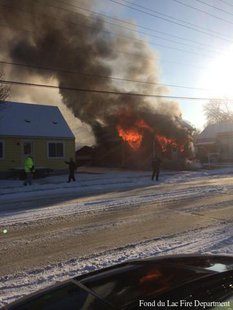 Firefighters battle a house fire at 65 N. Hickory St. on Monday, Dec. 9, 2013. (Photo from Fond du Lac Fire Department) Firefighters battle a house fire at 65 N. Hickory St. on Monday, Dec. 9, 2013. (Photo from Fond du Lac Fire Department)