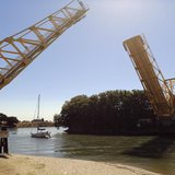 A sailboat cruises beneath a drawn bridge from a slough in the Sacramento San Joaquin River Delta near Walnut Grove, California September 4, A sailboat cruises beneath a drawn bridge from a slough in the Sacramento San Joaquin River Delta near Walnut Grove, California September 4,