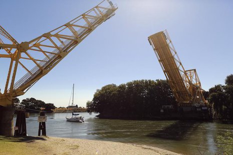 A sailboat cruises beneath a drawn bridge from a slough in the Sacramento San Joaquin River Delta near Walnut Grove, California September 4, A sailboat cruises beneath a drawn bridge from a slough in the Sacramento San Joaquin River Delta near Walnut Grove, California September 4,