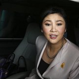 Prime Minister Yingluck Shinawatra leaves Army Club where she held a cabinet meeting in Bangkok December 10, 2013. Yingluck pleaded on Tuesd Prime Minister Yingluck Shinawatra leaves Army Club where she held a cabinet meeting in Bangkok December 10, 2013. Yingluck pleaded on Tuesd