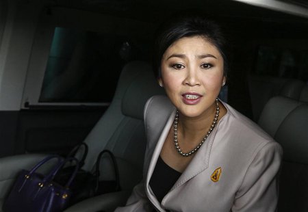 Prime Minister Yingluck Shinawatra leaves Army Club where she held a cabinet meeting in Bangkok December 10, 2013. Yingluck pleaded on Tuesd Prime Minister Yingluck Shinawatra leaves Army Club where she held a cabinet meeting in Bangkok December 10, 2013. Yingluck pleaded on Tuesd