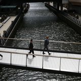 City workers cross a bridge in Canary Wharf, east London August 30, 2012. REUTERS/Olivia Harris City workers cross a bridge in Canary Wharf, east London August 30, 2012. REUTERS/Olivia Harris