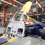 Engineers Bianca Gust (R) and Juergen Schweigard work in the Avionic Bay of an Eurofighter Typhoon while setting up all component parts of a Engineers Bianca Gust (R) and Juergen Schweigard work in the Avionic Bay of an Eurofighter Typhoon while setting up all component parts of a