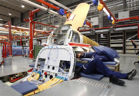 Engineers Bianca Gust (R) and Juergen Schweigard work in the Avionic Bay of an Eurofighter Typhoon while setting up all component parts of a Engineers Bianca Gust (R) and Juergen Schweigard work in the Avionic Bay of an Eurofighter Typhoon while setting up all component parts of a