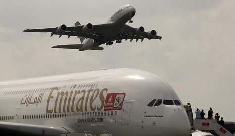An Airbus A380 aircraft of Deutsche Lufthansa (top) takes of passing over an Airbus A380 aircraft of Emirates at the ILA International Air S An Airbus A380 aircraft of Deutsche Lufthansa (top) takes of passing over an Airbus A380 aircraft of Emirates at the ILA International Air S