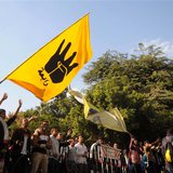 Students of Cairo University, who are supporters of the Muslim Brotherhood and ousted Egyptian President Mohamed Mursi, wave a flag bearing Students of Cairo University, who are supporters of the Muslim Brotherhood and ousted Egyptian President Mohamed Mursi, wave a flag bearing