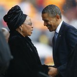 U.S. President Barack Obama (2nd R) pays his respect to former South African President Nelson Mandela's widow Graca Machel (2nd L) after his U.S. President Barack Obama (2nd R) pays his respect to former South African President Nelson Mandela's widow Graca Machel (2nd L) after his