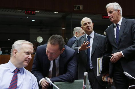 (L-R) European Union Economic and Monetary Affairs Commissioner Olli Rehn, Greece's Finance Minister Yannis Stournaras, France's Finance Min (L-R) European Union Economic and Monetary Affairs Commissioner Olli Rehn, Greece's Finance Minister Yannis Stournaras, France's Finance Min