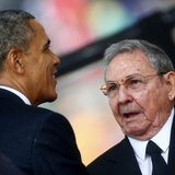 U.S. President Barack Obama (L) greets Cuban President Raul Castro before giving his speech at the memorial service for late South African P U.S. President Barack Obama (L) greets Cuban President Raul Castro before giving his speech at the memorial service for late South African P