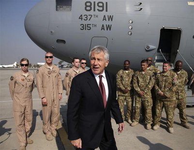 U.S. Secretary of Defense Chuck Hagel stands with U.S. troops before departing from Islamabad International Airport December 9, 2013. REUTER U.S. Secretary of Defense Chuck Hagel stands with U.S. troops before departing from Islamabad International Airport December 9, 2013. REUTER