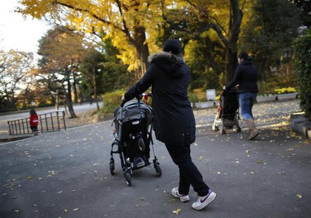 Filipino nannies stroll with children during their duty hours at a park in Tokyo November 29, 2013. REUTERS/Issei Kato Filipino nannies stroll with children during their duty hours at a park in Tokyo November 29, 2013. REUTERS/Issei Kato