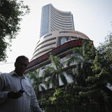 A man walks past the Bombay Stock Exchange (BSE) building in Mumbai December 5, 2013. REUTERS/Danish Siddiqui A man walks past the Bombay Stock Exchange (BSE) building in Mumbai December 5, 2013. REUTERS/Danish Siddiqui