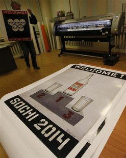 Russian artist Vasily Slonov carries a printed reproduction of an oil painting from the series "Welcome Sochi 2014" at a printing house in R Russian artist Vasily Slonov carries a printed reproduction of an oil painting from the series "Welcome Sochi 2014" at a printing house in R