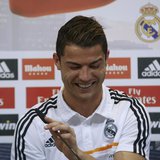 Real Madrid's Cristiano Ronaldo reacts as he attends a news conference to discuss the draw for the 2014 World Cup at the Valdebebas training Real Madrid's Cristiano Ronaldo reacts as he attends a news conference to discuss the draw for the 2014 World Cup at the Valdebebas training
