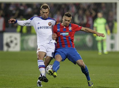 CSKA Moscow's Aleksei Berezutski (L) challenges Viktoria Plzen's Stanislav Tecl during their Champions League soccer match in Plzen December CSKA Moscow's Aleksei Berezutski (L) challenges Viktoria Plzen's Stanislav Tecl during their Champions League soccer match in Plzen December