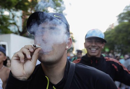 People participate in the so-called "Last demonstration with illegal marijuana" on their way to the Congress building in Montevideo, as Sena People participate in the so-called "Last demonstration with illegal marijuana" on their way to the Congress building in Montevideo, as Sena