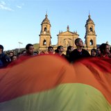 Supporters of Bogota's mayor Gustavo Petro wave an LGBT flag during a protest against his removal at Bogota's Bolivar Square December 10, 20 Supporters of Bogota's mayor Gustavo Petro wave an LGBT flag during a protest against his removal at Bogota's Bolivar Square December 10, 20