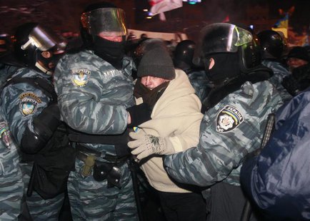 Riot police officers detain a protester in Kiev December 11, 2013. Ukrainian riot police moved in force early on Wednesday into part of the Riot police officers detain a protester in Kiev December 11, 2013. Ukrainian riot police moved in force early on Wednesday into part of the