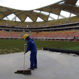 A workman next to the pitch inside the Arena Amazonia stadium as work continues in preparation for the 2014 FIFA World Cup soccer championsh A workman next to the pitch inside the Arena Amazonia stadium as work continues in preparation for the 2014 FIFA World Cup soccer championsh
