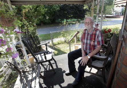 Les Cadman sits on the front porch of his home located across the street from where the plaza for a new international bridge is slated to be Les Cadman sits on the front porch of his home located across the street from where the plaza for a new international bridge is slated to be
