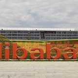 A worker walks past a logo of Alibaba Group at its headquarters on the outskirts of Hangzhou, Zhejiang province, August 24, 2013.REUTERS/Chi A worker walks past a logo of Alibaba Group at its headquarters on the outskirts of Hangzhou, Zhejiang province, August 24, 2013.REUTERS/Chi
