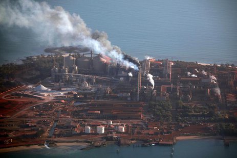 Smoke billows from chimneys at the Rio Tinto alumina refinery in Gove, also known as Nhulunbuy, located 650 kilometers (404 miles) east of D Smoke billows from chimneys at the Rio Tinto alumina refinery in Gove, also known as Nhulunbuy, located 650 kilometers (404 miles) east of D
