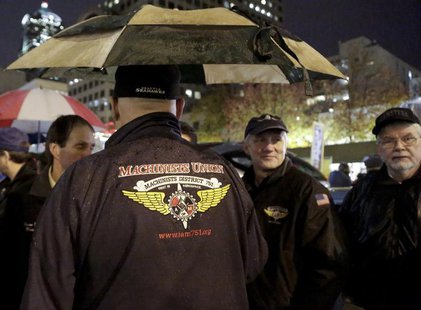 Members of the International Association of Machinists and Aerospace Workers (IAM) union gather during a rally organized by the Washington S Members of the International Association of Machinists and Aerospace Workers (IAM) union gather during a rally organized by the Washington S