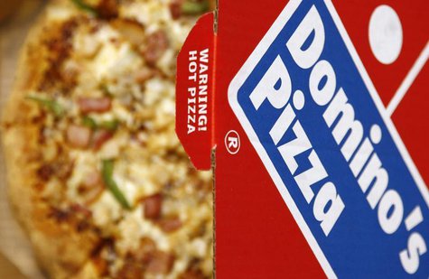A Domino's Pizza is pictured in its box in central London, February 15, 2009. REUTERS/Luke MacGregor A Domino's Pizza is pictured in its box in central London, February 15, 2009. REUTERS/Luke MacGregor