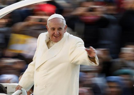 Pope Francis waves as he arrives to conduct his weekly general audience at St. Peter's Square at the Vatican December 11, 2013. REUTERS/Giam Pope Francis waves as he arrives to conduct his weekly general audience at St. Peter's Square at the Vatican December 11, 2013. REUTERS/Giam