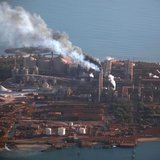Smoke billows from chimneys at the Rio Tinto alumina refinery in Gove, also known as Nhulunbuy, located 650 kilometers (404 miles) east of D Smoke billows from chimneys at the Rio Tinto alumina refinery in Gove, also known as Nhulunbuy, located 650 kilometers (404 miles) east of D